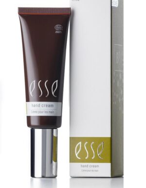 A tube of Esse Hand Cream is displayed alongside its packaging. The tube boasts a dark brown hue complemented by a silver cap and white text, while the box features a sleek white design with an olive green accent. Both the tube and the box prominently display the brand name "Esse" and the product description "Hand Cream.