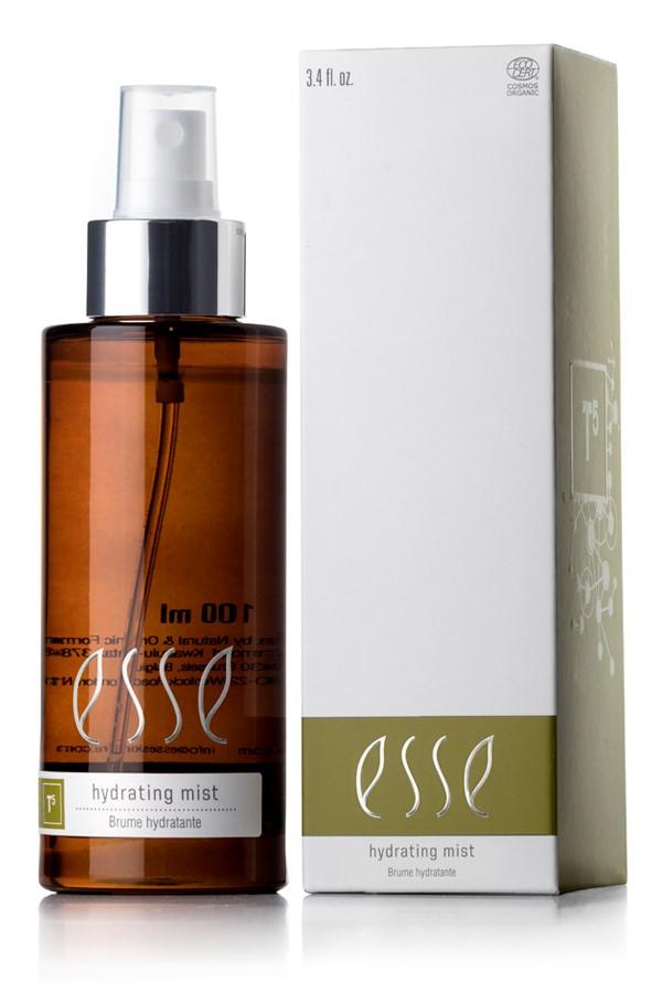 A brown spray bottle labeled "Esse Hydrating Mist" stands beside its matching white and green box, both featuring the product name.
