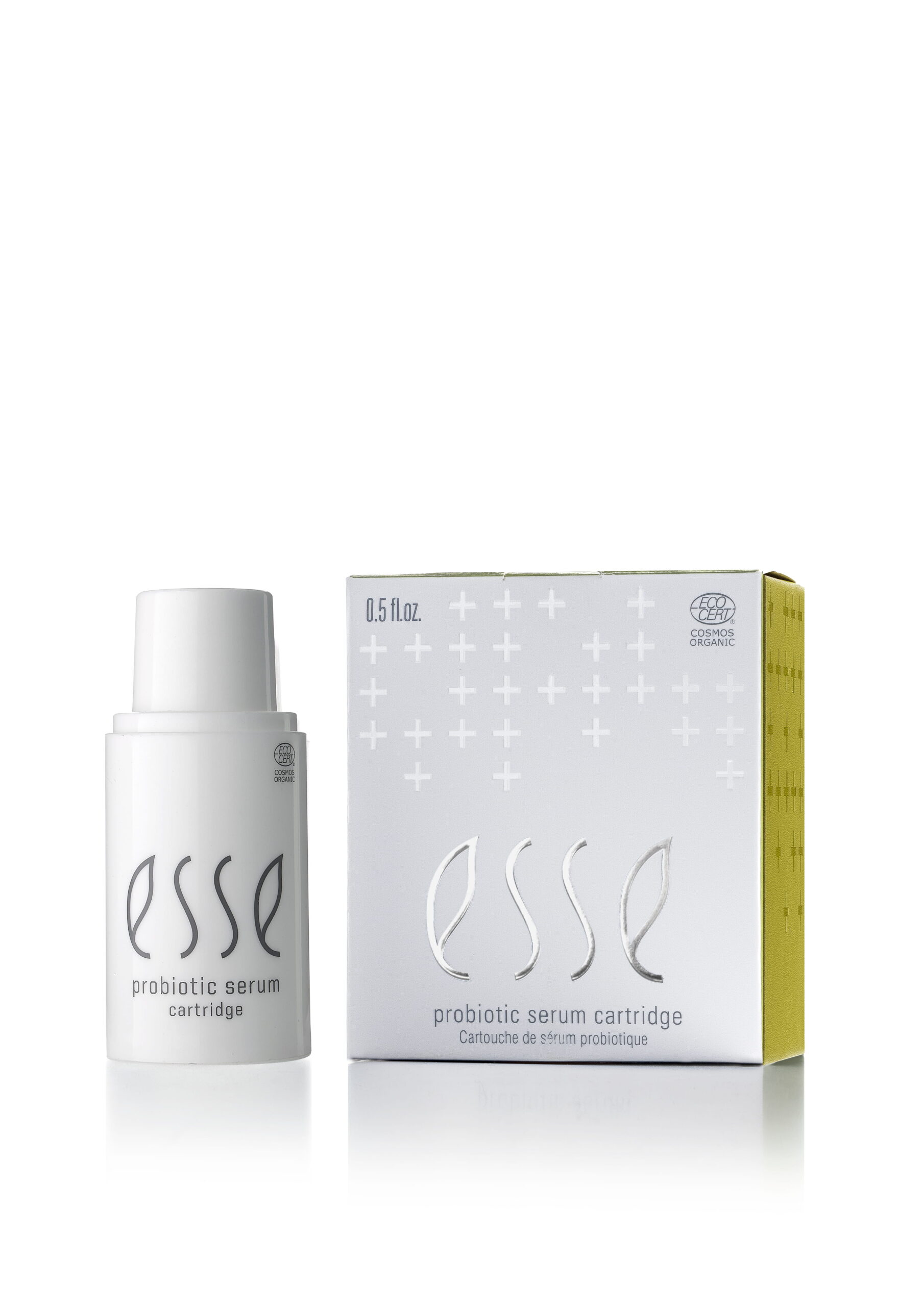 A white bottle labeled "Esse Probiotic Serum" stands beside its matching box, both featuring a minimalist design with gray crosses and the product name, set against a white background.